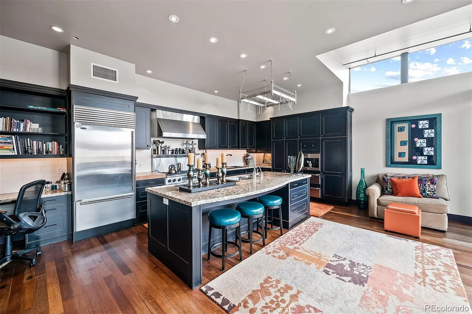 Kitchen island with breakfast bar and adjacent home office